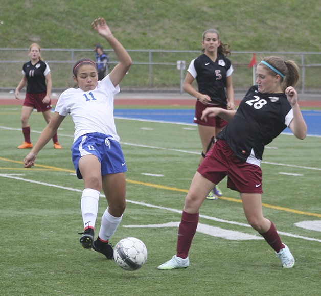 Mary Brach fights for the ball during Kentlake's win over Federal Way Friday.