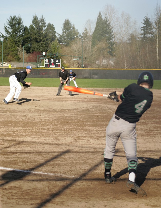 Kentwood senior Chaz Lopez swings at a pitch during the Thursday game against Tahoma. The Conks won 4-1. Kentwood leads the league with an undefeated 4-0 record.