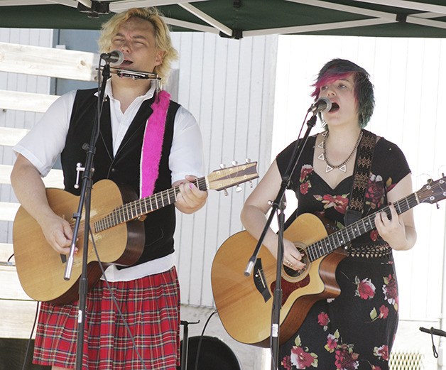 Dace Anderson and Arielle Young perform at the Maple Valley Farmers Market Aug. 2. Dace’s Rock ‘n’ More Music Academy has a studio in Maple Valley and Redmond offering music instruction and lessons. Dennis Box