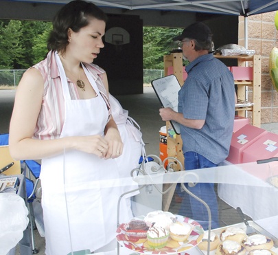 Andrea Pickett of Baked Goodies in the booth at the Maple Valley Farmers Market on June 20