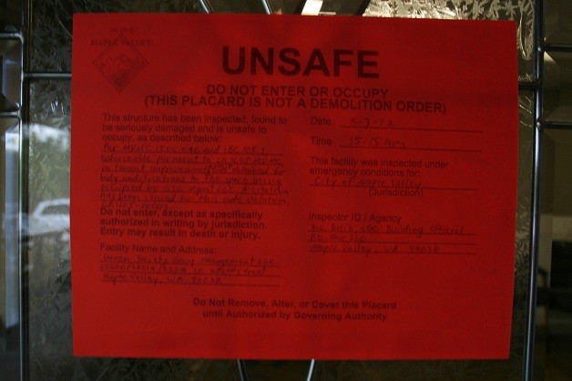 The unsafe notice posted on the front of Green Society Group in Maple Valley.