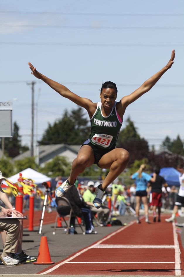 Kentwood senior Madelayne Varela leaps in the air during the long jump. Varela took second at state in the long jump.