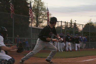 Austin Williamson lays down a bunt against Curtis Friday in the South Puget Sound League playoffs at Kent Memorial.