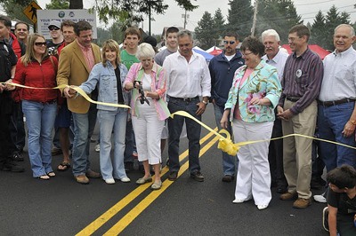 Mayor Rebbeca Olness performs the ribbon cutting ceremony Saturday at Miners Day in Black Diamond along with King County Councilman Reagan Dunn and City Council members Kristine Hanson