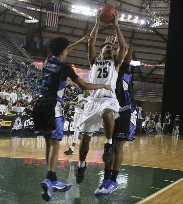 Darius Lubum goes up for a shot against Curtis.