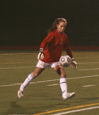 Tahoma High goalie Amber Woolcock clears the ball Wednesday at home. She shutout Skyline for 80 minutes and two overtime periods during the first round of the state 4A girls soccer playoffs.