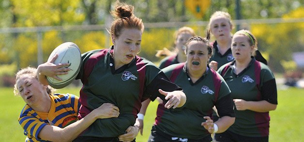 Savannah Benson tries to elude an opponent during a Kent Crusaders rugby game in May. The Crusaders U19 team