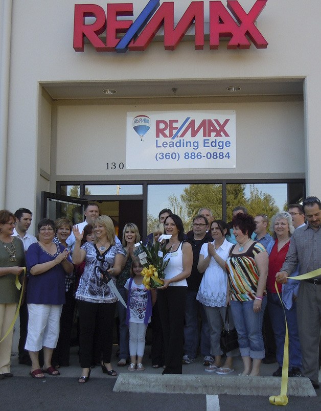 Danielle Bricker celebrates after cutting the ribbon outside of the RE/MAX Leading Edge on May 19.
