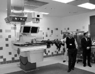 Two Valley Medical Center leaders – chief executive officer Rich Roodman (left) and Hospital District 1 Commissioner Anthony Hemstad – listen to staff members on a tour of eight new operating rooms at the hospital. All of the rooms are bigger than Valley Medical’s existing ORs.