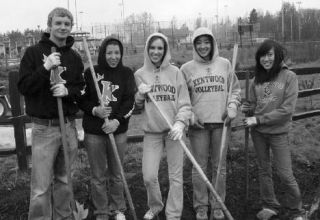 Participants in recent Earth Day-themed service included Kentwood High School students (from left) Nick Moloney