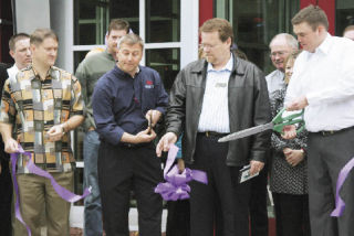 A sneak preview of the Red Robin restaurant that will open next Monday included a ribbon-cutting ceremony. Doing the snipping Wednesday were (from left) Jim Wene