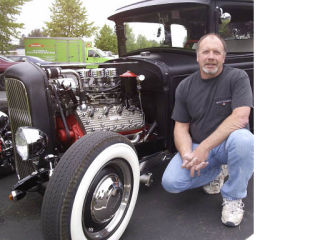 Covington resident Phil Hunter sometimes drives his 1930 Ford Model A to work. “At $4.29 a gallon for gas