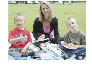 Elise Beadell spent part of Wednesday afternoon at Lake Wilderness Park for a Maple Valley Library-sponsored storytime with her sons Josh (right) and Jake
