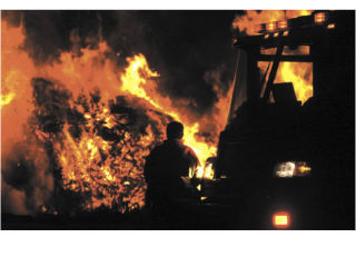 A large wood debris fire broke out late Tuesday near State Route 18 and Covington-Sawyer Road