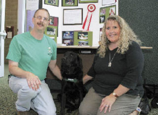 Don and Kelli Reiter led a recruitment event at Covington Library July 22 for prospective trainers of guide dogs for blind people.