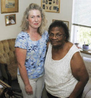 Maureen Carney (left) visits Henri Ann Buford every Tuesday as a volunteer chore worker with Catholic Community Services. Carney runs errands or cleans Buford’s apartment