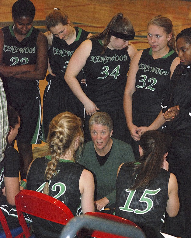 Kentwood coach Lisa Ashley talks to two of her seniors Jenny Johnson