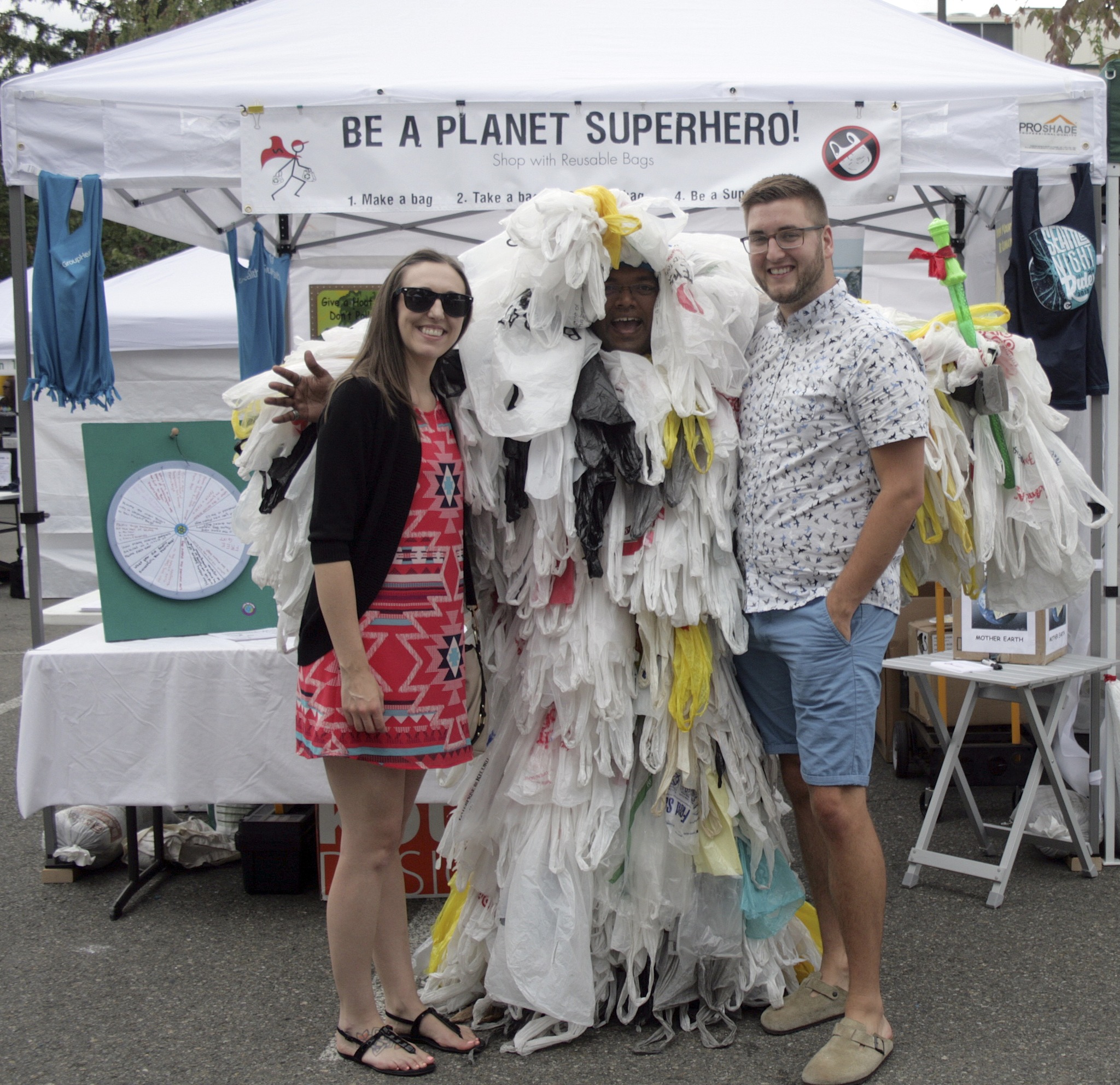 Slyvester Vijay Rozario dressed in plastic bags poses with festival-goers July 17 at Covington Days near the Bag Busters booth. ANA KAREN PEREZ GUZMAN