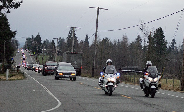 Police officers from 14 different departments volunteered to take part in the funeral procession for 3-year-old Howard “Howie” Koch on Dec. 4.
