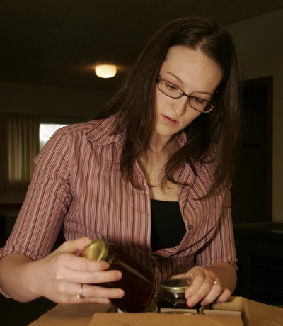 Nicki Fromel of Black Diamond goes through jars of her jam she plans to sell at the Maple Valley Farmers’ Market this summer.
