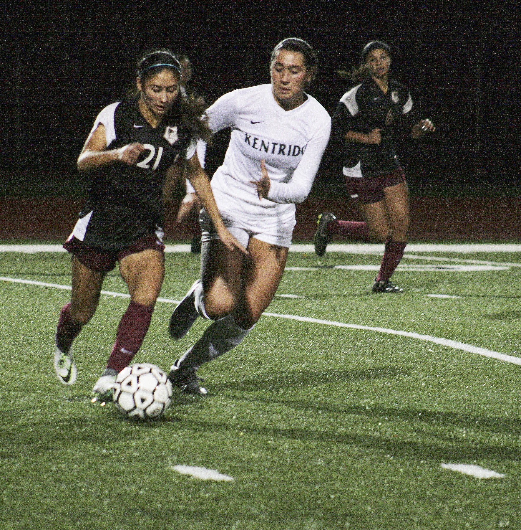 Kentlake junior Alexis Newsom tries to maintain possession of the ball during Friday’s away game at Kentridge High School. The Falcons lost to the Chargers 3-0. SARAH BRENDEN