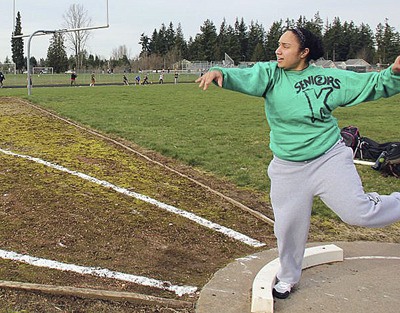 Kentwood graduated Alyx Toeaina throws the discus during a practice at school. Toeaina signed on with the University of Washington at the beginning of the track season. courtesy photo
