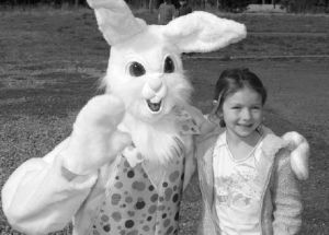 Isabella Foxley poses with the bunny of the hour during the Easter egg hunt hosted March 22 by Mountain Vineyard Christian Fellowship in Covington.