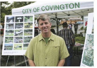 Scott Thomas got an early start on his job as the new parks director by “meeting people and hearing what they want” at the city’s booth at Covington Days.