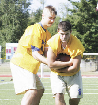 Tahoma High School quarterback Heyden Johnson (left) and running back Kurt LaFranchi are two big reasons the Bears are brimming with optimism this fall. The pair are two of the South Puget Sound League North Division’s top returning offensive players.