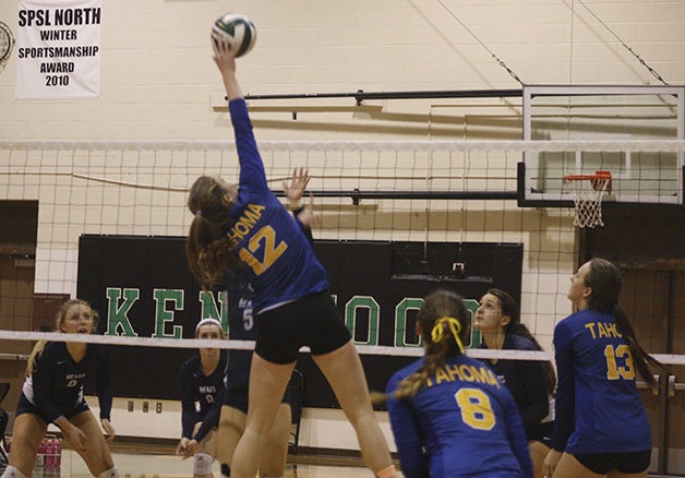 Tahoma junior Ginny Mehl hits the ball over the net during the Bears first round game Friday at Kentwood High School.