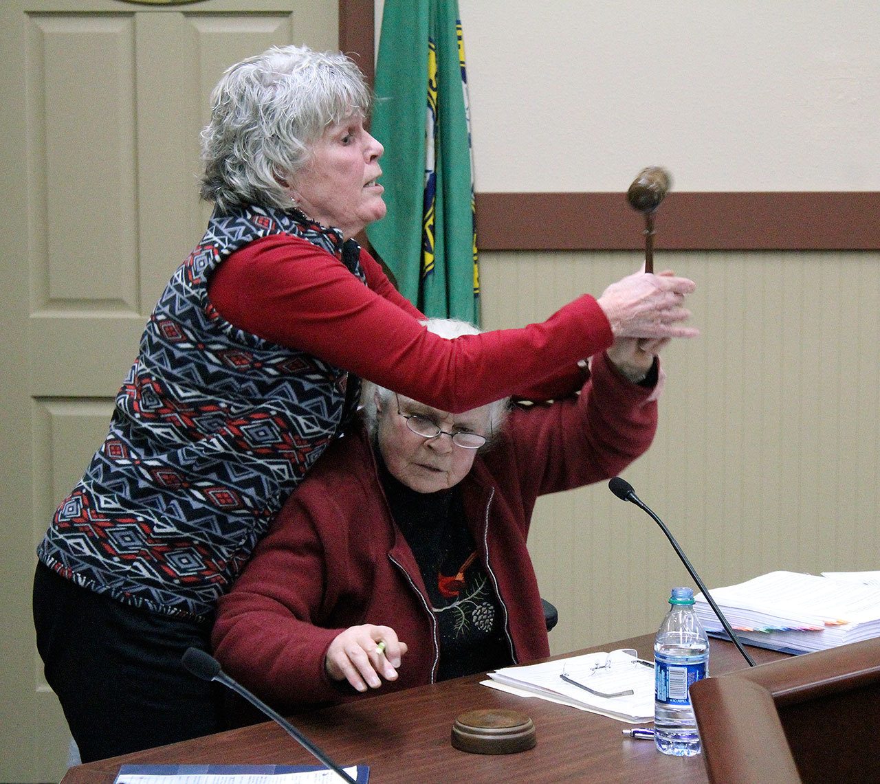 During a recess called by Mayor Carol Benson, Mayor Pro Tempore Erika Morgan took Benson’s seat as chair and attempted to continue the council meeting. Benson wrested the gavel from Morgan as Black Diamond police officers stepped in. Ray Still, The Reporter
