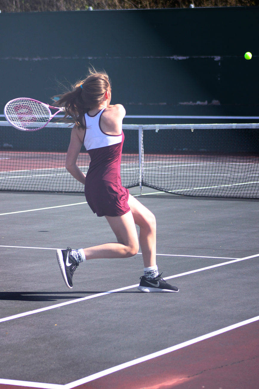 Amy Bender from Kentlake volleys during her win over Kentwood’s Brianna Stroud. Bender won the match 6-2, 6-0.