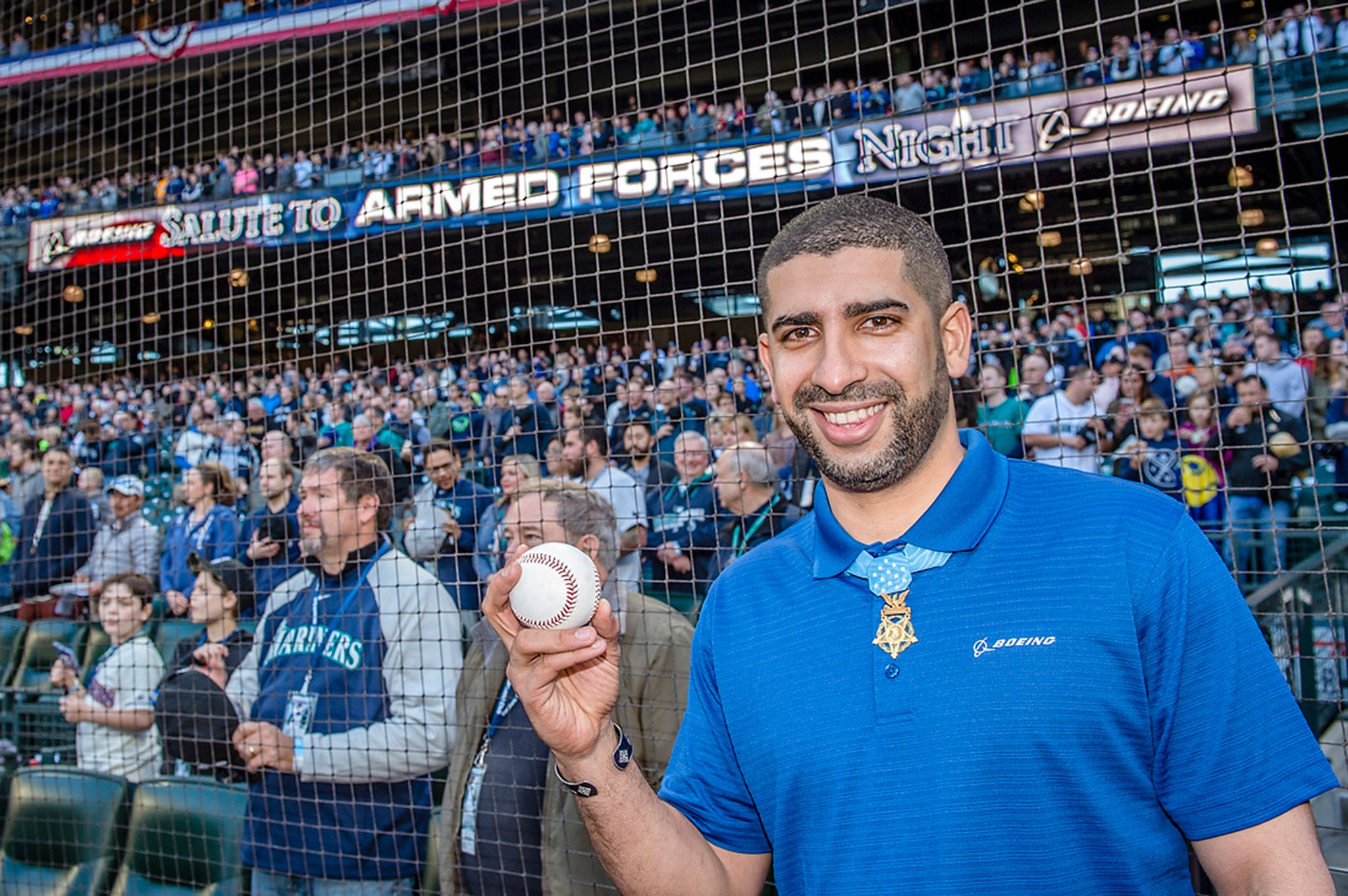 Flo Groberg, Boeing’s director of veterans outreach and Medal of Honor recipient, prepares to throw out the ceremonial first pitch at the Mariners Salute to Armed Forces game, sponsored by Boeing.