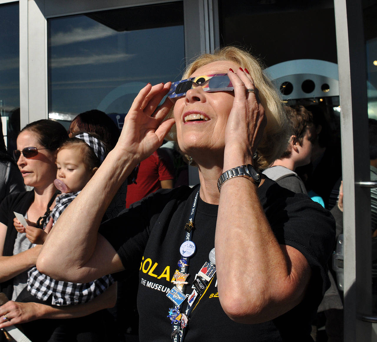 A woman looks in awe at the eclipse. HEIDI SANDERS, Reporter
