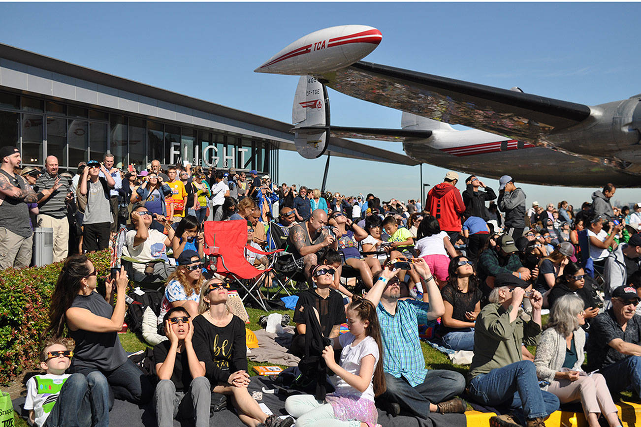 Thousands flock to Museum of Flight to view eclipse