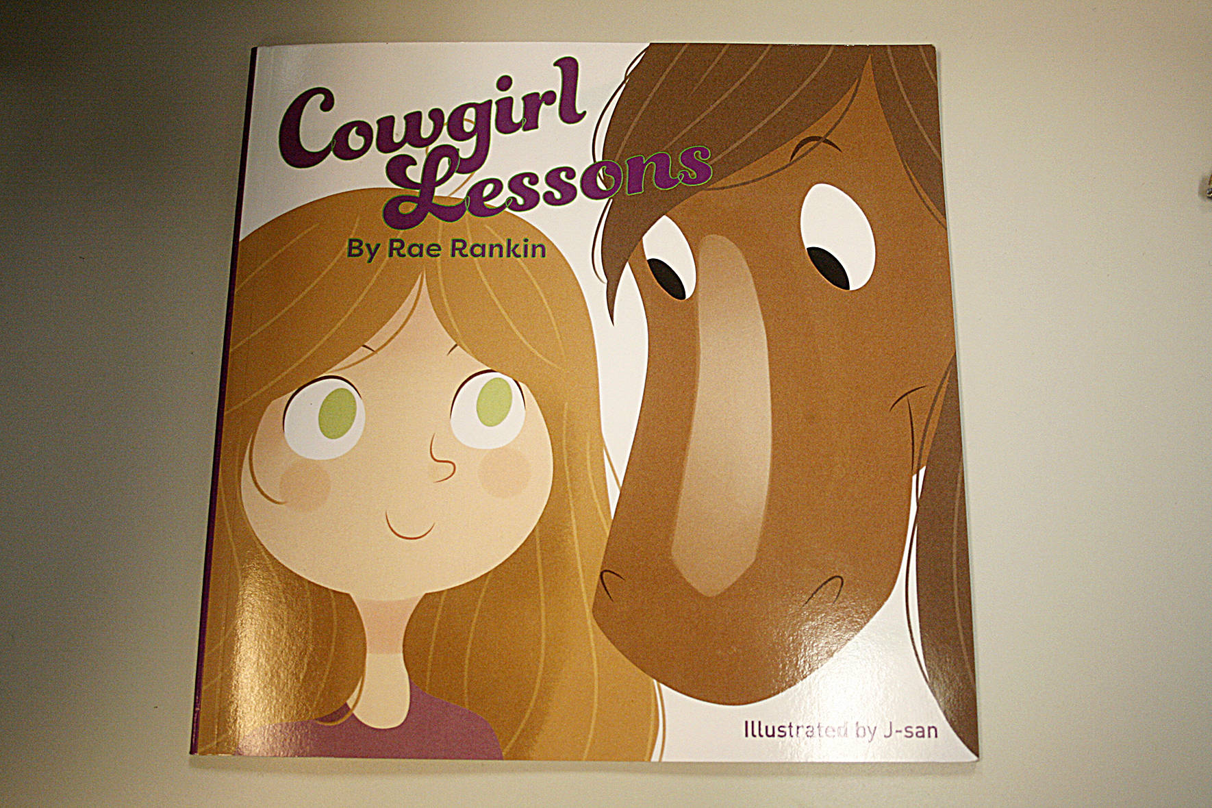Rae Rankin wrote “Cowgirl Lessons” for her daughter when her favorite horse died. The story follows a little girl, fashioned after Rankin’s daughter, who spends the day taking care of her horse. LEAH ABRAHAM, RENTON REPORTER