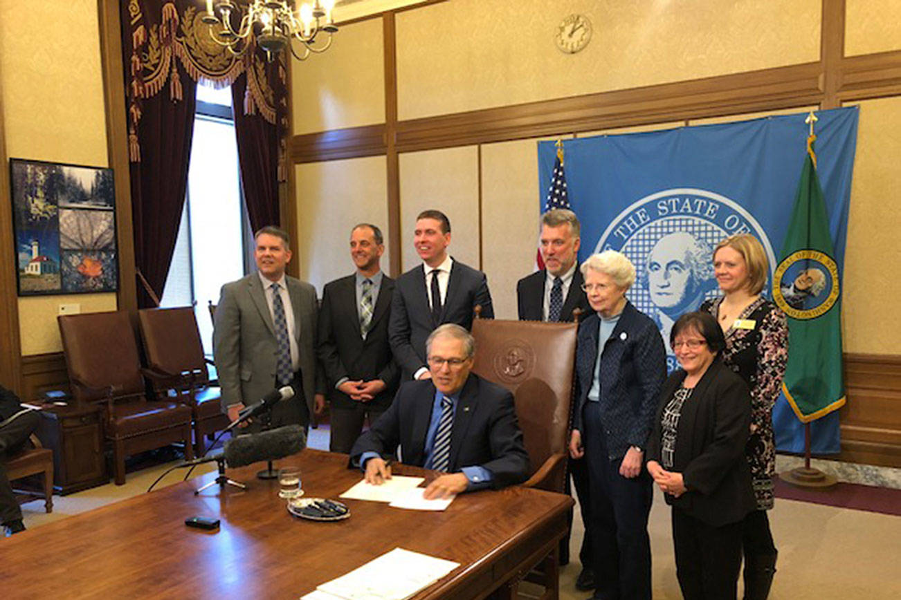 Gov. Inslee signing the bill on March 15. Submitted photo