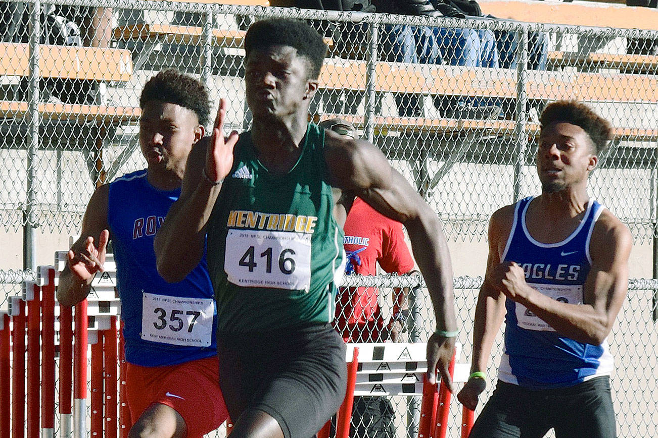 Kentridges Solomon Hines dashes to victory in the 100 meters at 10.87 seconds. RACHEL CIAMPI, Kent Reporter