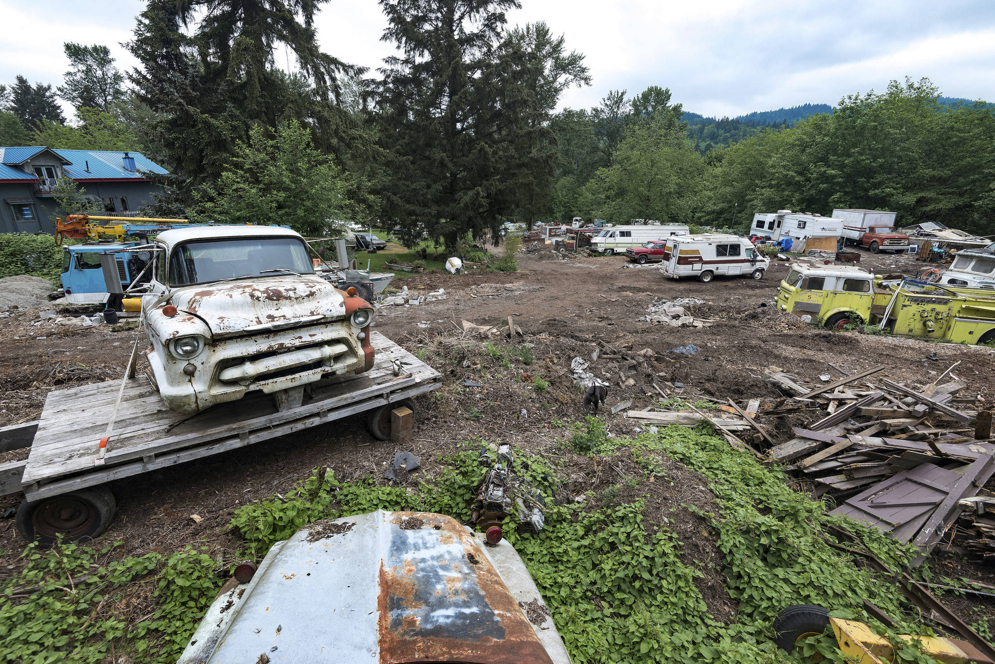 The 10 acre plot known as Iron Mountain is home to countless broken-down cars, boats, fire trucks, buses, and even a street sweeper. The sprawling junkyard encircles Pillon’s home. Photo by Caean Couto