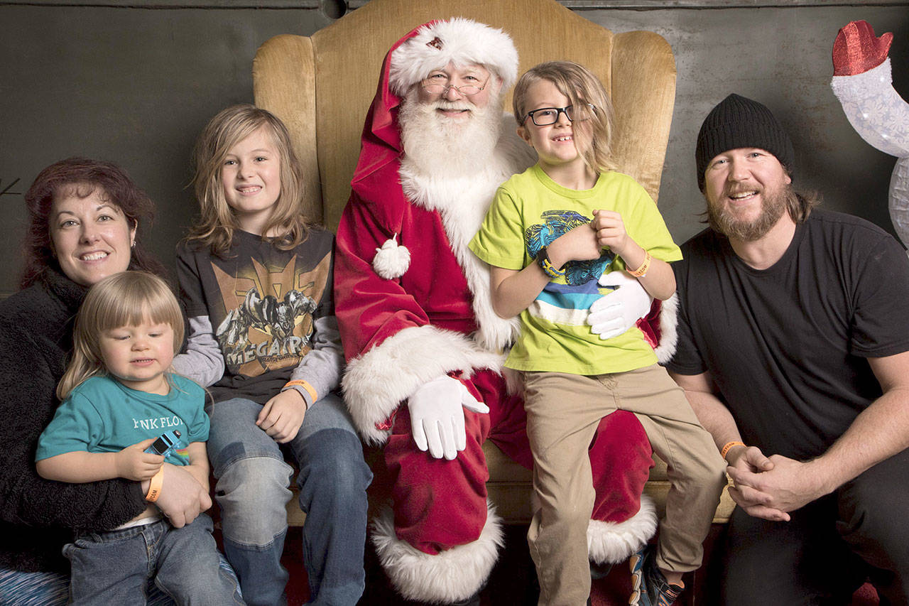 The Drake family poses with Santa in 2017. From left are Jenny, Dylan, Braeden, Zachary and Jerry Drake. (provided by family)