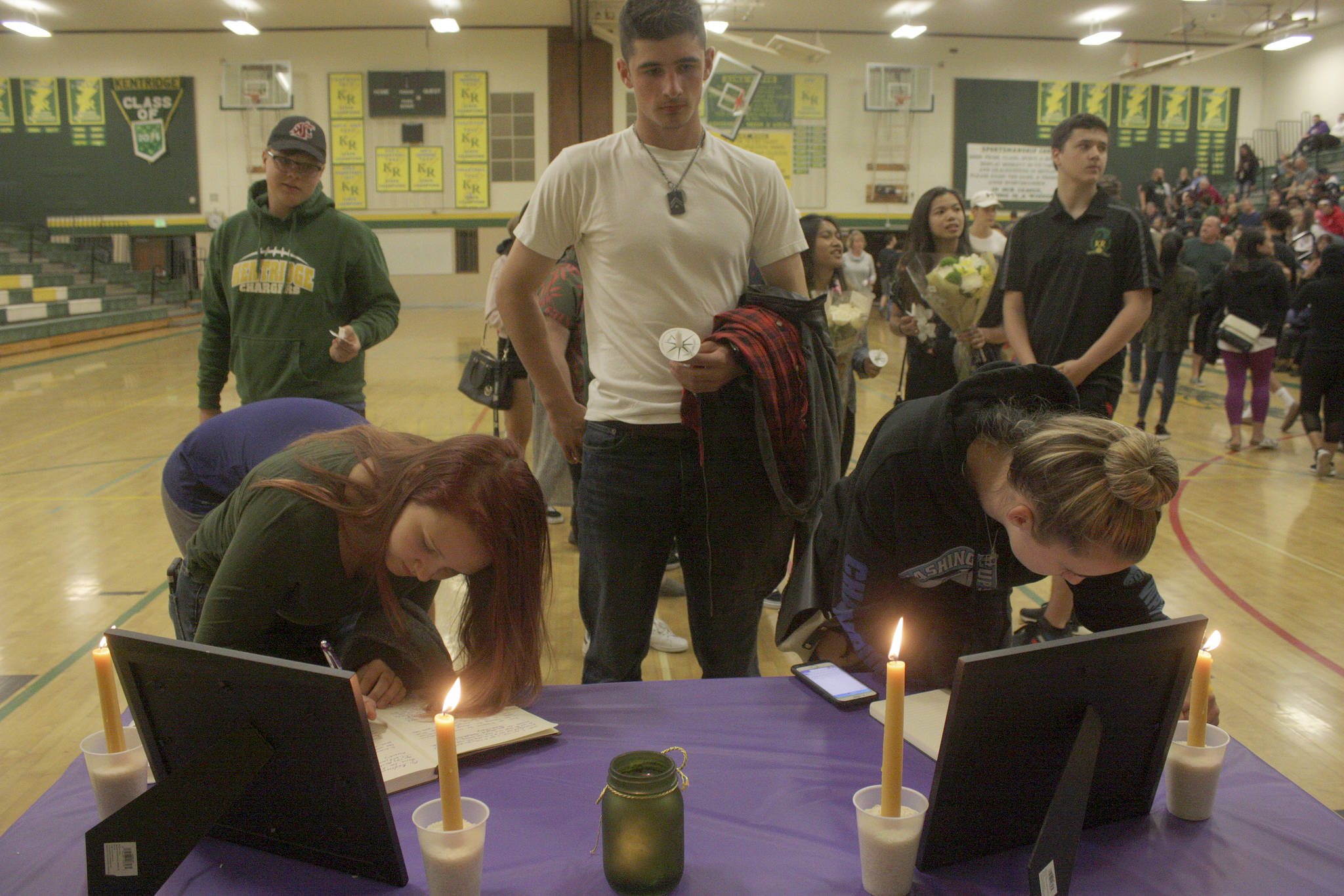 Mark Klaas, Kent Reporter                                Students and supporters line up in the gym to sign memorial books to honor Eric Anderson, Kentridge’s athletic director who passed away Saturday.