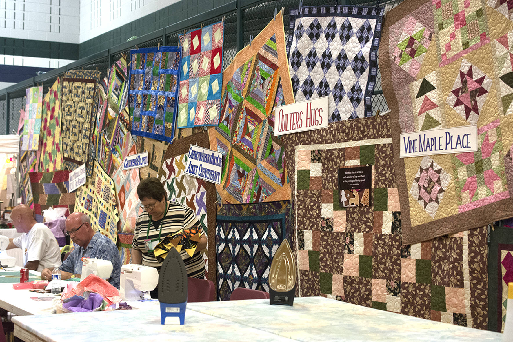 Photo by Kayse Angel                                Quilts the Covington Quilters Guild made for different organizations hang on display at the 2018 Quilt Show.