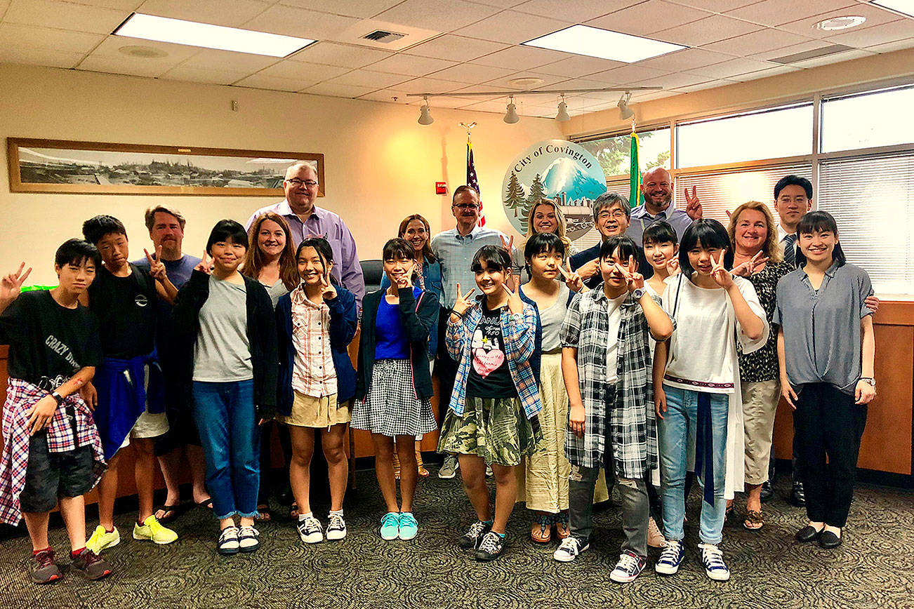 Students from the Sister City Exchange Program stand with city of Covington officials at                                Covington City Hall. Submitted photo
