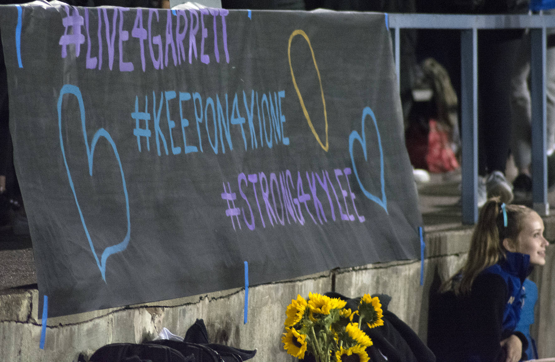 Students made a sign to display at the last home Tahoma football game on Sept. 21 to honor the death of their fellow students who have died. Photo by Kayse Angel