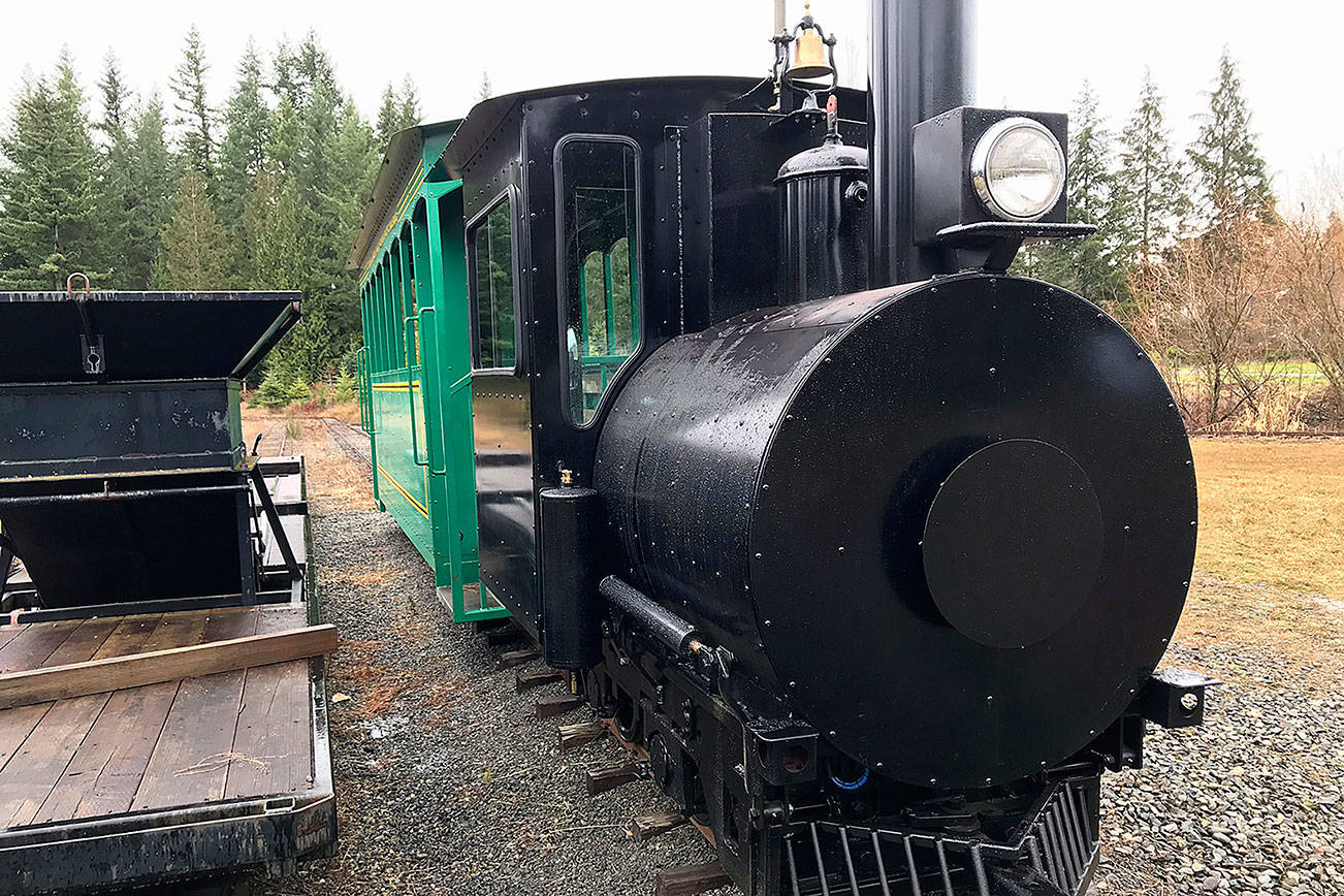 The train that Harvey Hawken spent 18 years fixing up has been put to good use this holiday season by transporting people around the Crystal Creek Tree Farm. Photo by Kayse Angel
