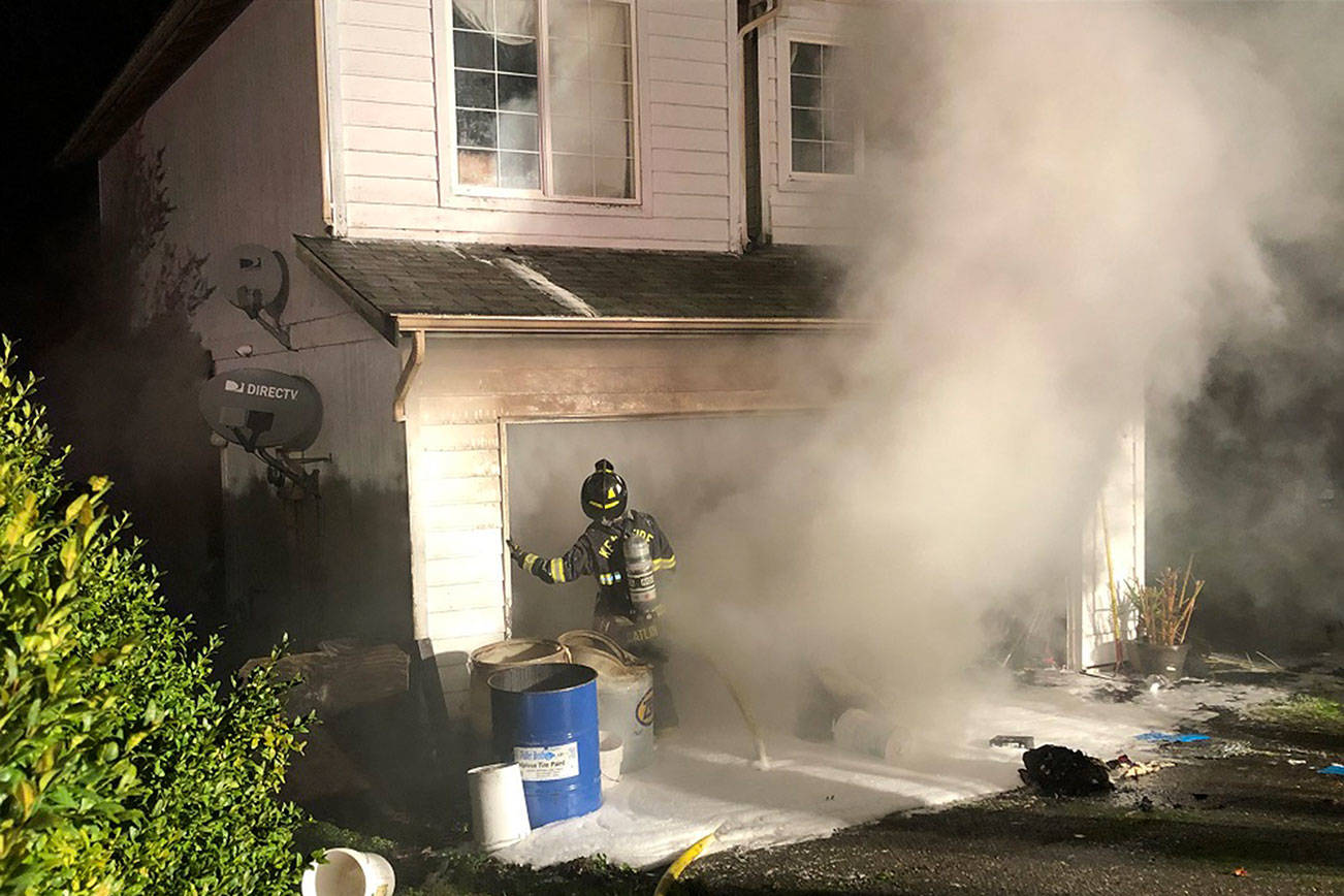 Firefighters work to extinguish a fire that occured at a Covington home on Jan. 6. Submitted photo from the Puget Sound Regional Fire Authority.