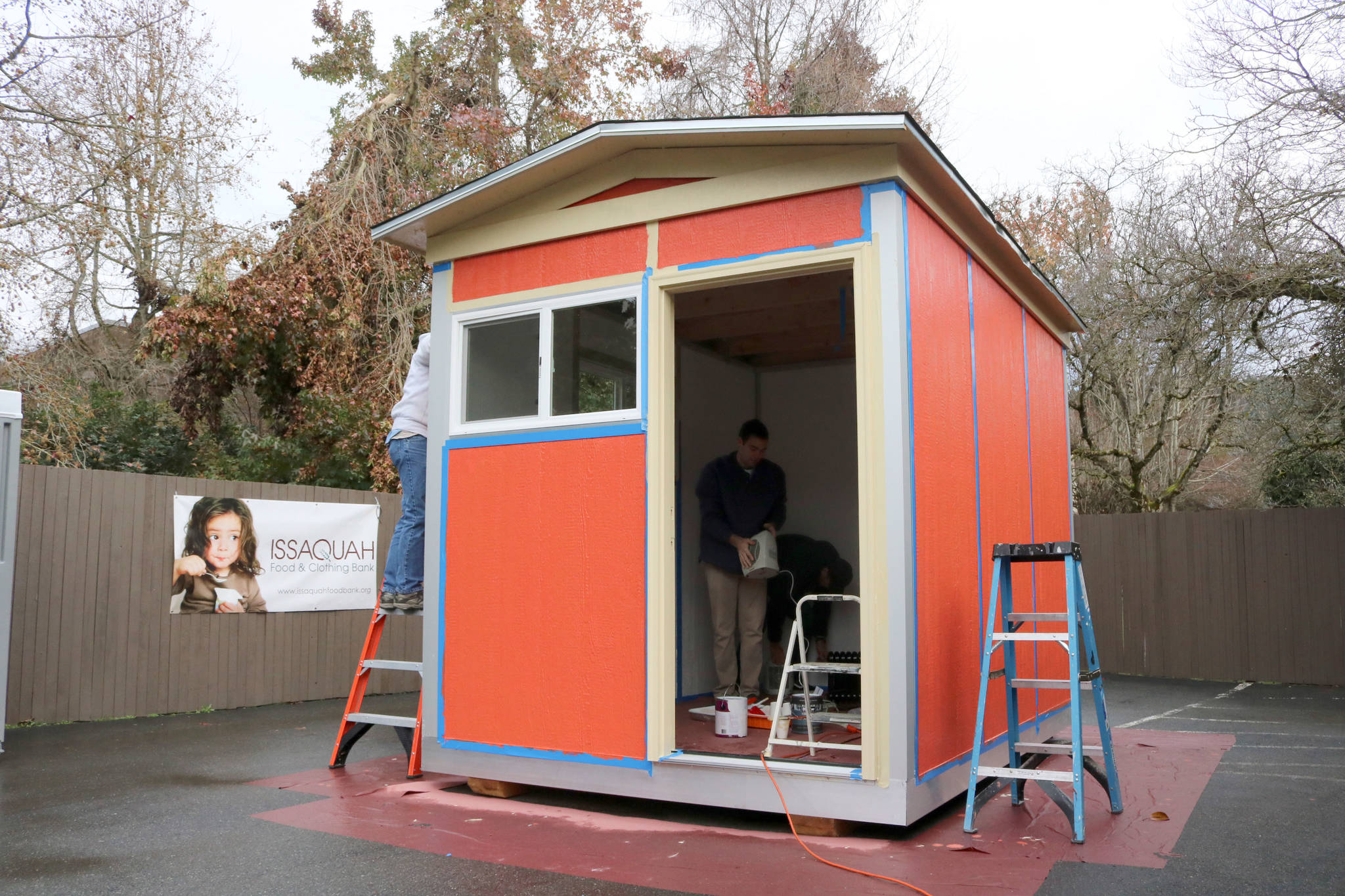 Volunteers in Issaquah finish a tiny house last December before donating it to the Low Income Housing Institute’s newest village for homeless residents in Olympia. The 8-foot by 12-foot house featured insulation, electricity, heat, windows, and a lockable door. Evan Pappas/Staff photo