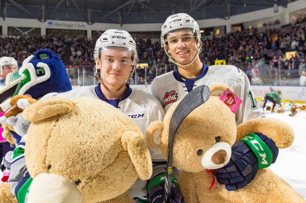 COURTESY PHOTO, Brian Liesse, T-Birds                                Players help gather the furry donations from the Fred Meyer Teddy Bear Toss Night presented by WARM 106.9 FM.