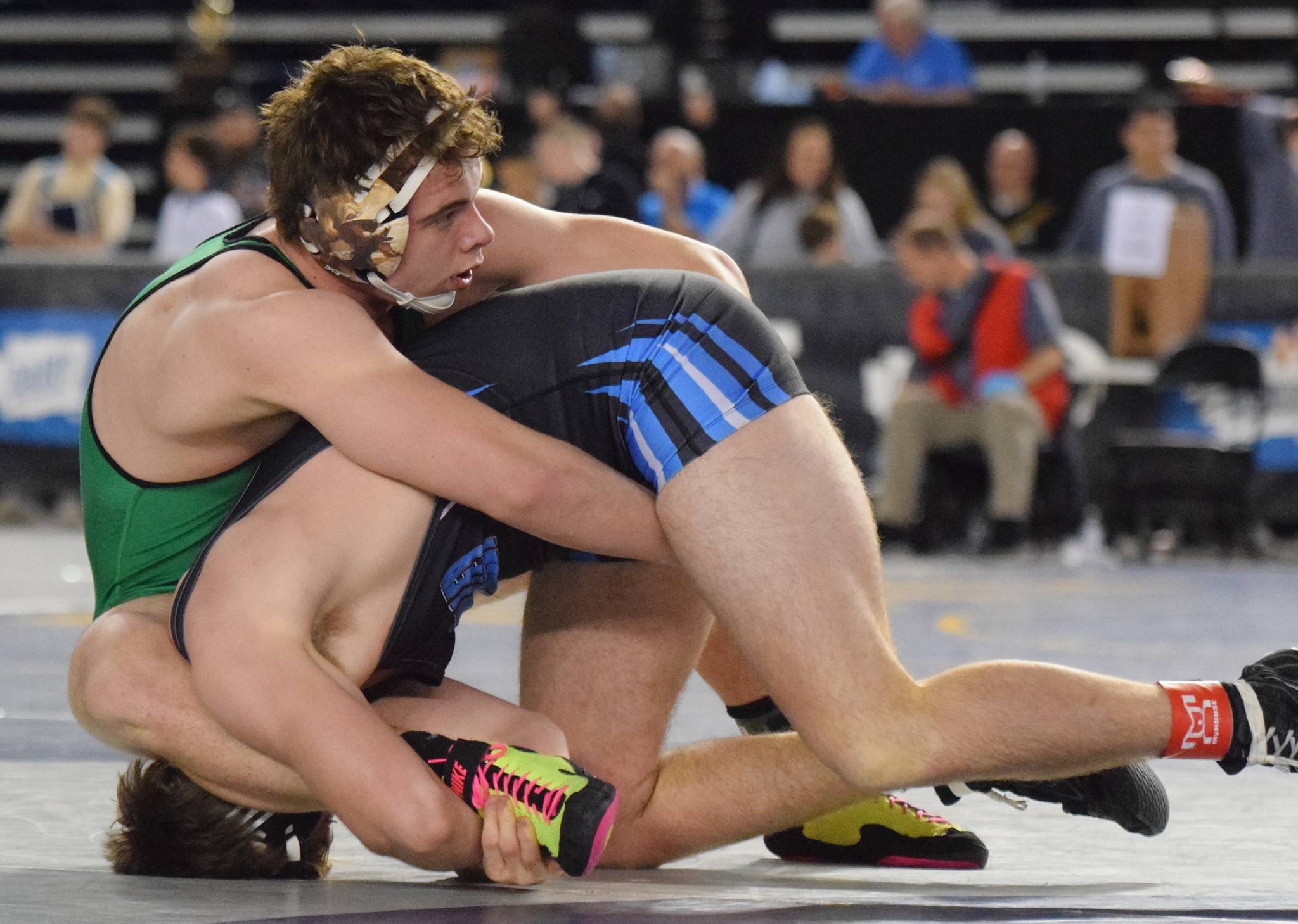 Kentwood’s 195-pound sophomore Dominic Kremer, top, tangles with Central Valley of Spokane’s Cade Byus during consolation round action at Mat Classic XXXI. Kremer won by a 1-0 decision to finish seventh in his weight class. RACHEL CIAMPI, Kent Reporter