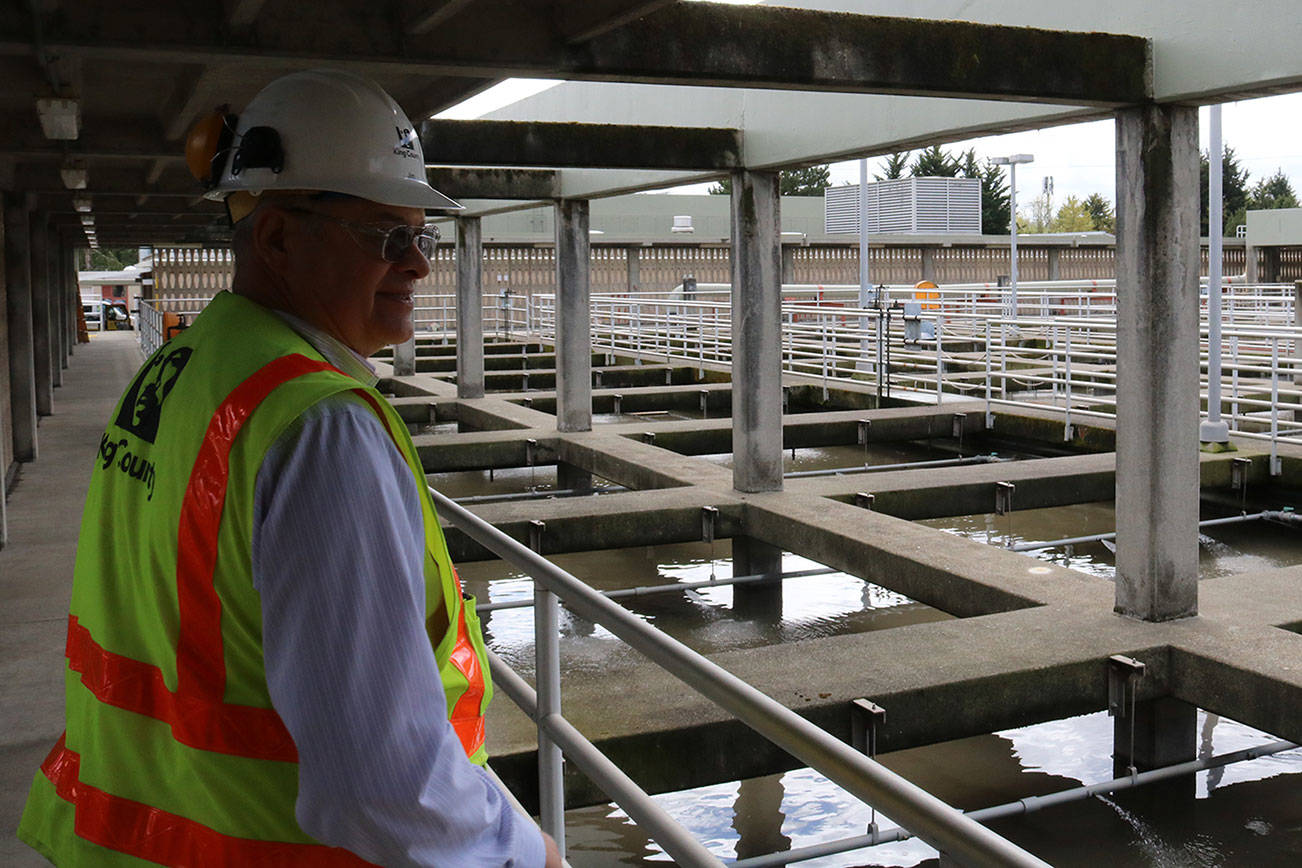 Jim Pitts stands on walkway overlooking filtration chambers at the King County South Treatment Plant in Renton. Aaron Kunkler/staff photo